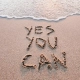 Imagen con el texto Yes you can escrito en la arena de la playa motivación Quiropráctico Badalona